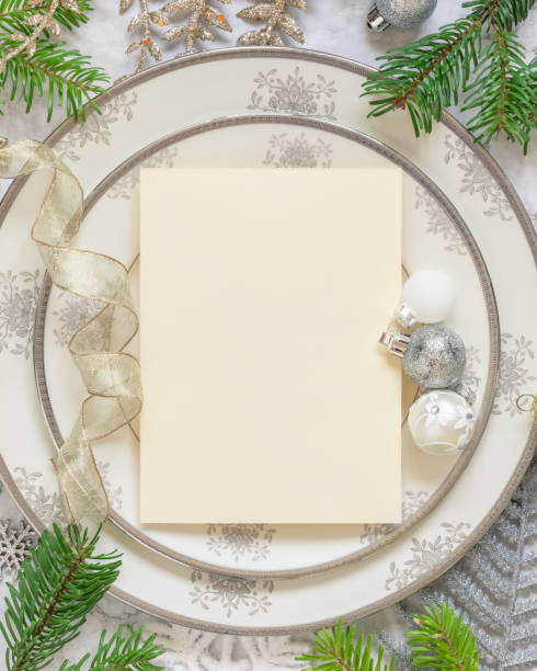 istock Festive table setting of with fir tree branches and Christmas decorations. Greeting card mockup 1346519094