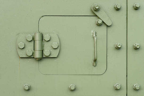 Backgrounds and textures: heavy armoured steel door, military green khaki