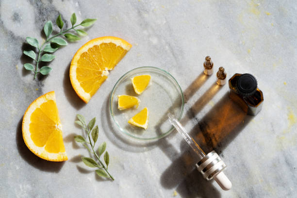 citrus fruit vitamin c serum oil beauty care - vitamin a letter a food orange imagens e fotografias de stock