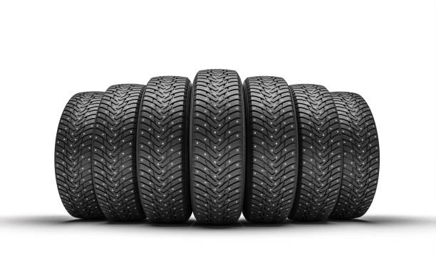 istock group of winter tires on white. 1346520110