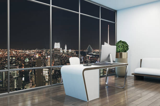 istock Contemporary designer office interior with workplace, night city view and other items. 3D Rendering. 1346521513
