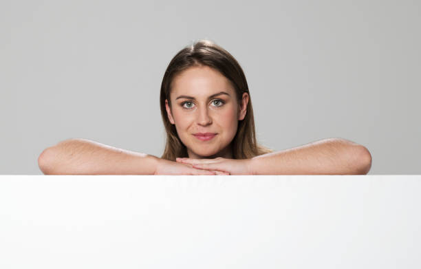 istock Close-up of young woman leaning on white polystyrene board 1346524510