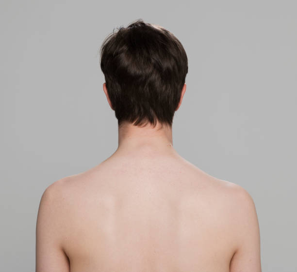 istock Rear view of shirtless young man 1346524530