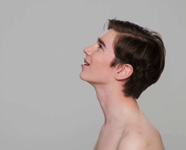 istock Side view of thoughtful shirtless young man 1346524554
