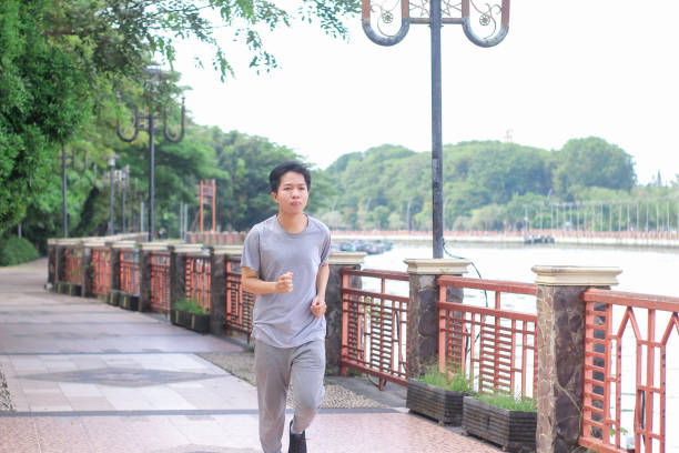 istock Young men doing exercise at a public park during a sunny day 1346524710