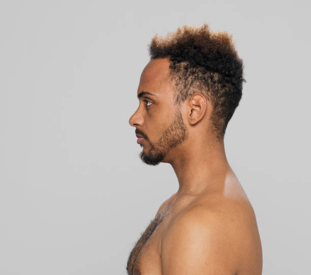 istock Profile of serious shirtless young man 1346525400