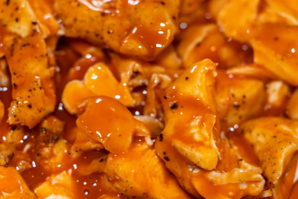 Roasted chicken tenderloin roasted then sliced and marinated in buffalo sauce.