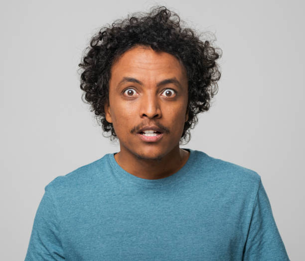 istock Close-up of shocked young man 1346530165