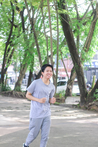 istock Young men doing exercise at a public park during a sunny day 1346530245