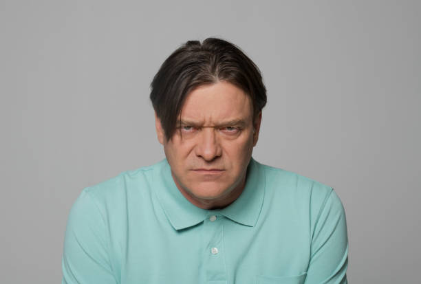 istock Close-up of angry mature man 1346530707