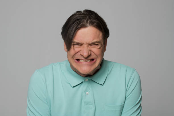 istock Close-up of mature man making funny face 1346530711