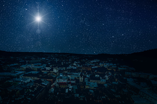 The star shines over the manger of christmas of Jesus Christ.