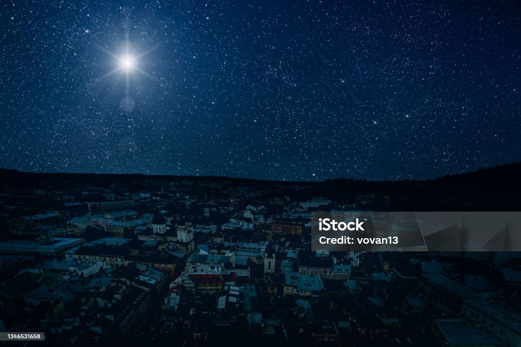 The star shines over the manger of christmas of Jesus Christ. Nativity Scene Stock Photo