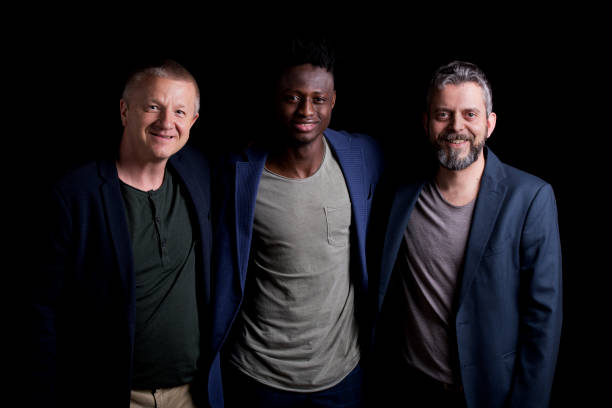 istock Smiling friends standing together 1346531814