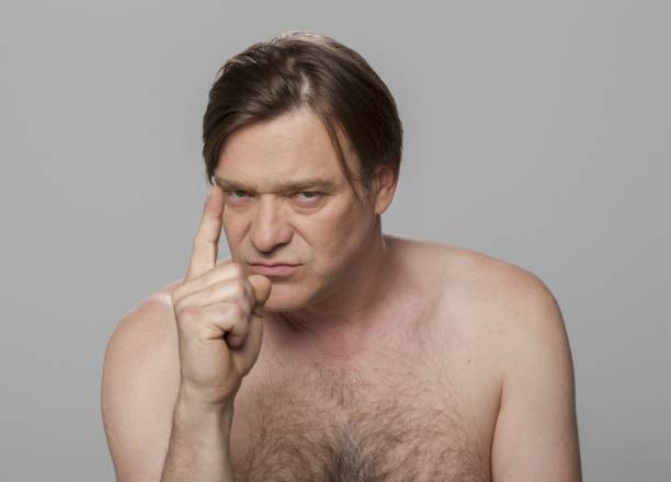 istock Close-up of angry mature man pointing index finger 1346532026