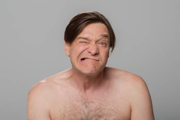 istock Close-up of mature man winking eye 1346532033