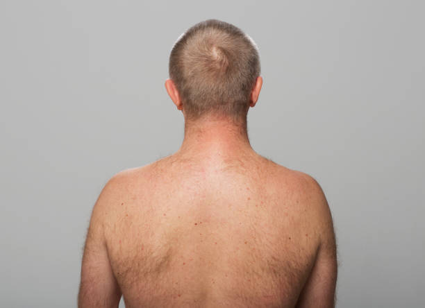 istock Rear view of shirtless mature man 1346532282