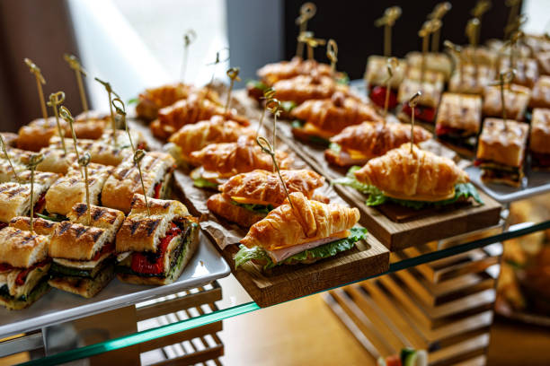 istock Stacks of croissant sandwich at event. 1346533793