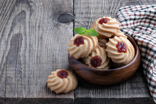 istock Qurabiya cookie shortbread with jam on rustic wooden table 1346534382