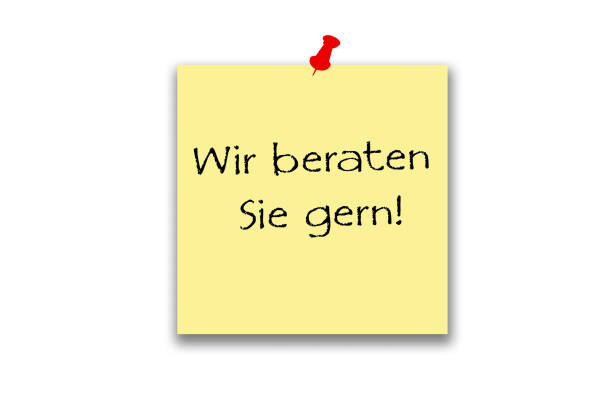 Stock photo showing close-up view of a wall with a single askew, yellow adhesive note, with a curled up corner, stuck to it, available for messages to be written. Ideation, creative thinking and idea storming concept.