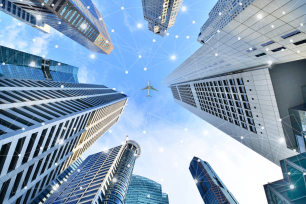 istock Smart city and wireless communication network on skyscrapers Central Business District in Singapore 1346537109