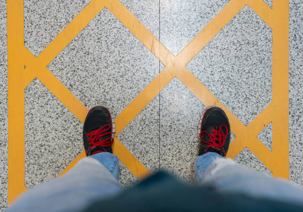 istock Men Standing on the Marble Floor 1346537226