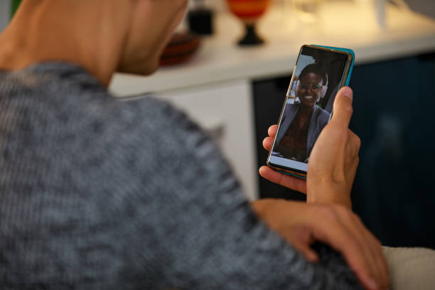 istock Selective focus shot of young man video chatting with his girlfriend 1346537918