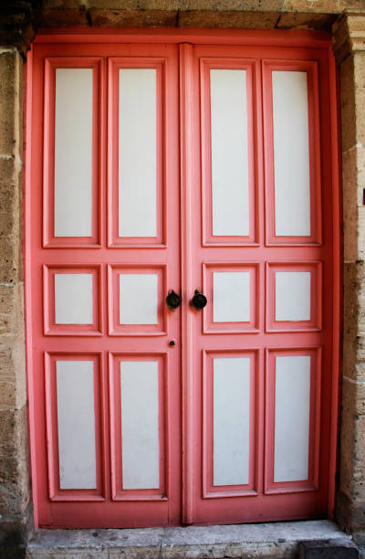 istock old wooden doors with graphic ornaments 1346539452