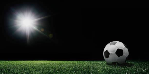 istock football field with glowing spotlight 1346539473