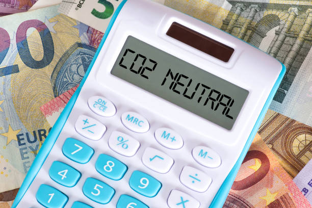 istock Euro banknotes, calculators and costs for CO2 neutrality 1346539652