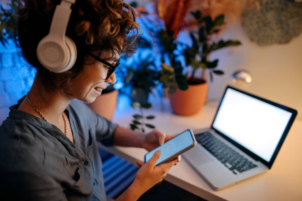 istock Late night working from home in living room 1346540253