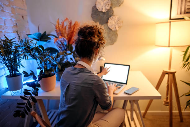 istock Late night working from home in living room 1346540388