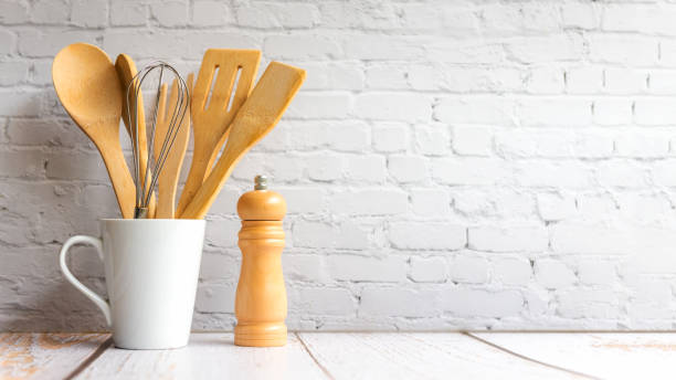 istock Kitchen tools and kitchenware utensil object with ingredients on kitchen shelf wood white for healthy eat and health care life.  Wall white brick background, copy space for text 1346540402