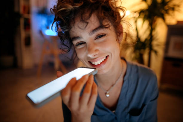 istock Young woman looking smartphone in dark room. 1346540694
