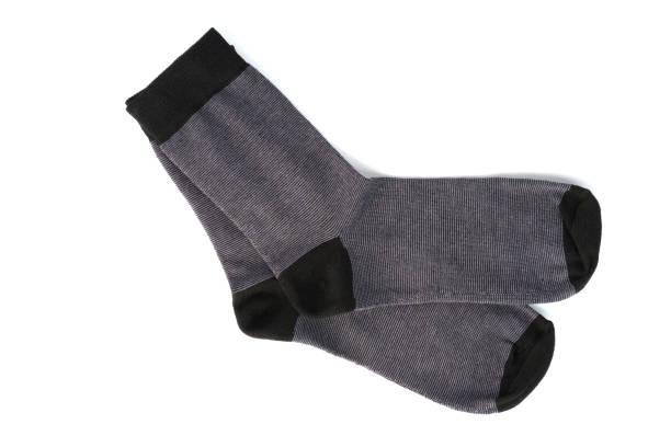istock knitted socks isolated on white. gray men's socks 1346540795