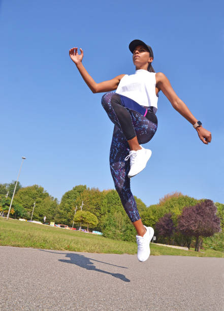 istock Fitness latin woman outdoors jumping 1346542703