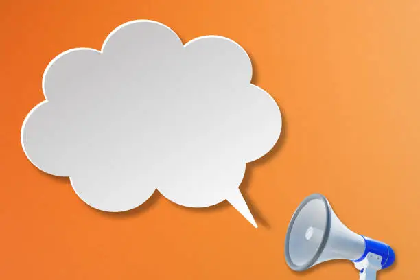 Photo of Megaphone with blank white speech bubble on orange background. Template with copy space for text for design
