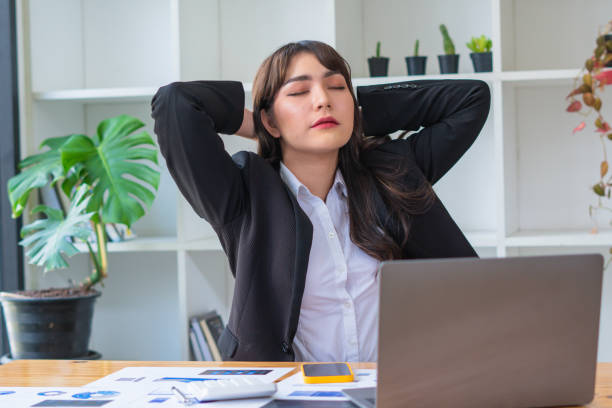 istock Asian working women relaxed from work, she was glad. 1346548808