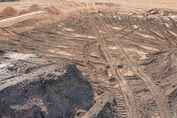 istock Aerial view at the construction site during earthworks progress. 1346549702