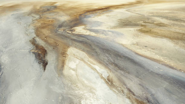 istock Beautiful patterns in sand and clay, an old sand pit. View from a great height 1346550239