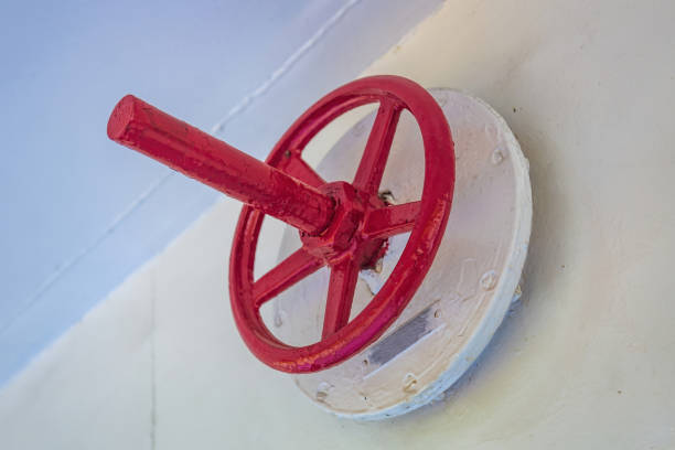 istock Old weathered iron industrial outdoor pipeline valve 1346551484