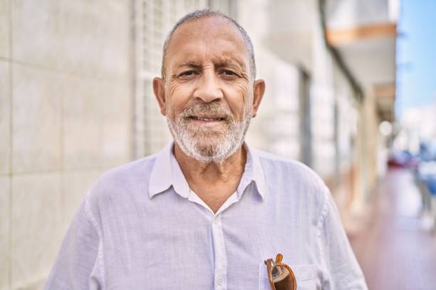 istock Senior man smiling confident at street 1346552490