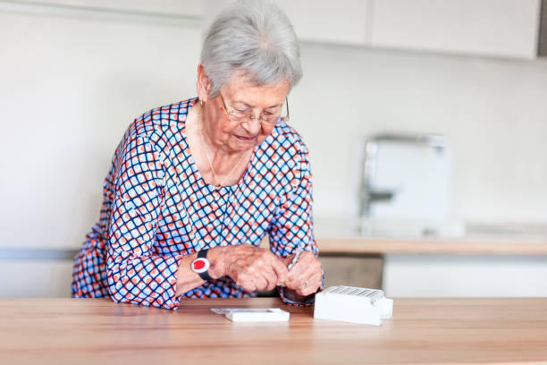 istock Senior woman putting pills into pill box 1346553939