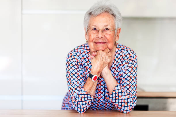 Senior woman with emergency alarm button