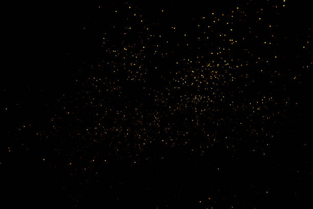 istock Golden abstract bokeh on black background. 1346554910