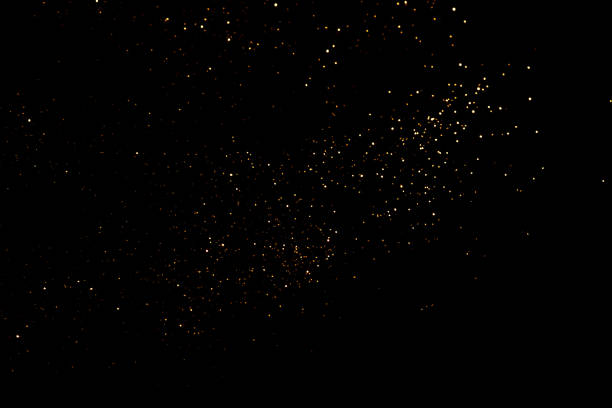 istock Golden abstract bokeh on black background. 1346554911
