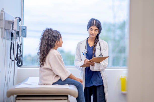 istock Hispanic Girl at a Check-up 1346555516