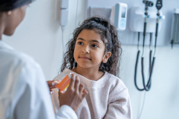 Doctor Instructing a Young Patient on Proper Inhaler Usage