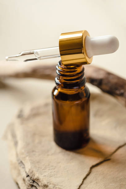 istock One brown cosmetic bottle on a natural beige background. 1346555926
