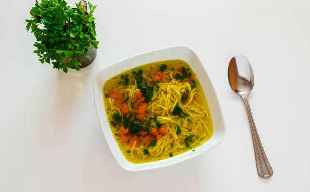 istock broth with noodles, decorated with parsley and carrots 1346556041